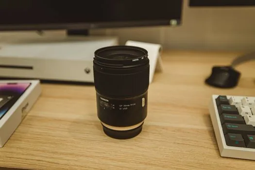 a close-up of clean white HEPA filter layers and an activated carbon filter being inspected on a wooden table, soft daylight, editorial product photography, shallow depth of field, no people, no text