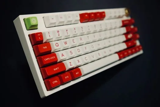 a top-down view of a mechanical keyboard with keycaps removed showing red and brown switches, soft natural window light, clean wooden desk, editorial product photography, shallow depth of field