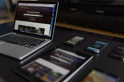 AI laptop and smartphone on desk with chip specification comparison