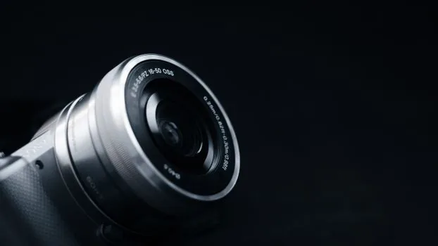 close-up of a usb webcam lens and body on a desk, sharp detail, soft window light, product photography, shallow depth of field
