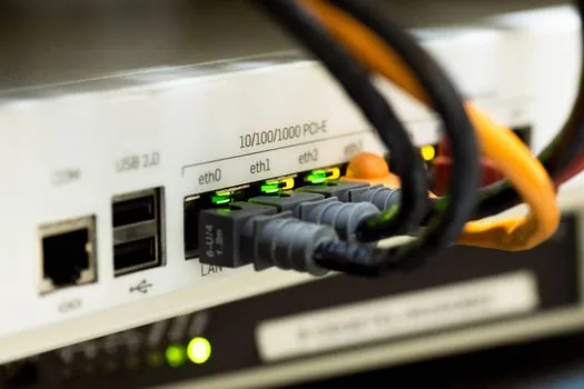 close-up of the back panel of a flat tv showing hdmi ports with a cable being plugged in, macro detail, soft even light, editorial photography