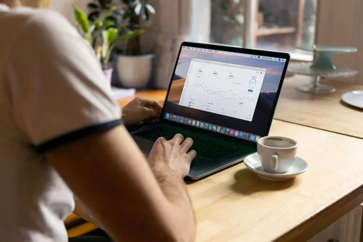 person checking Windows account settings on laptop