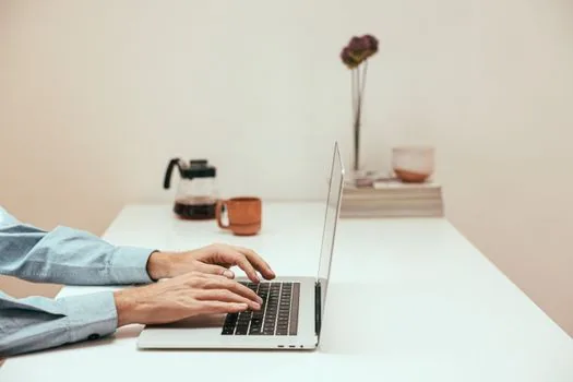 person using laptop keyboard shortcut