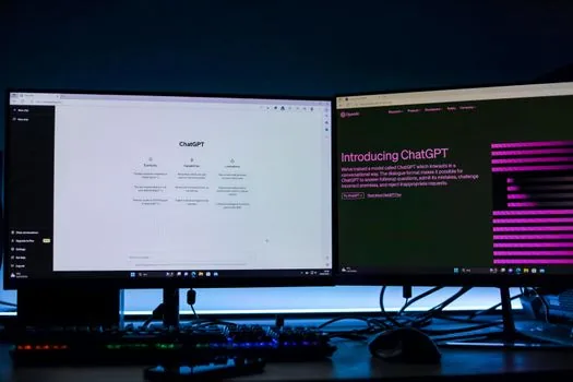 smartphone scanning Discord QR login code on desktop monitor with confirmation prompt