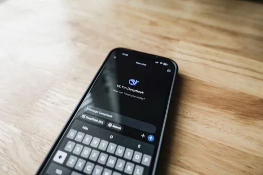 smartphone showing Meta AI chat and privacy settings on a clean table