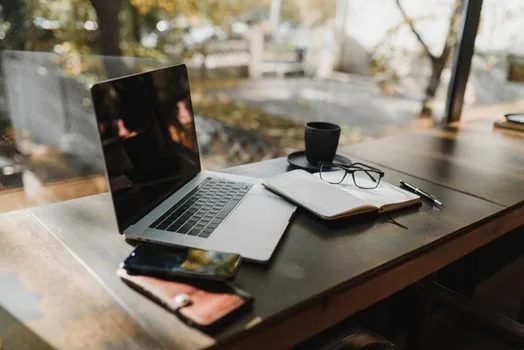 Windows security checklist with laptop and notebook