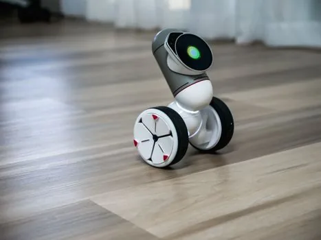 close-up of robot service checklist showing battery pack, wheel brush, sensor module, emergency stop icon, realistic editorial product inspection photo