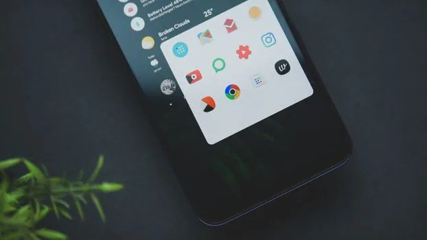 Galaxy settings app list sorted by recently installed apps after unwanted pop-up ads, privacy-safe realistic phone troubleshooting scene