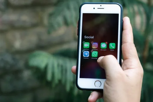iPhone user editing selected photo access for one app, small group of travel and document photos selected, realistic privacy settings guide