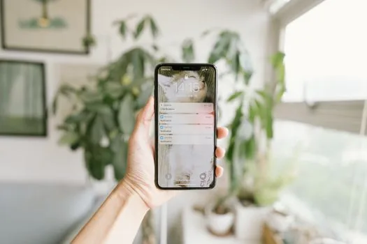 Korean smartphone showing two KakaoTalk message types, promotional channel message and delivery notification separated on clean table, realistic editorial photo