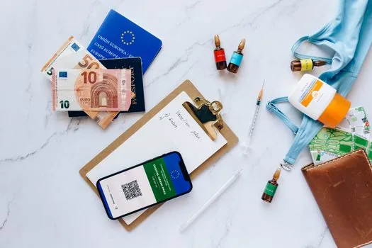 printed recovery codes being placed in a small home document box beside passport and phone, Korean home office daylight, realistic security checklist photo | 백업 코드를 휴대폰 밖에 따로 보관하는 장면