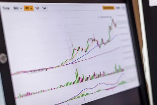 AI API pricing comparison spreadsheet on monitor with token usage chart