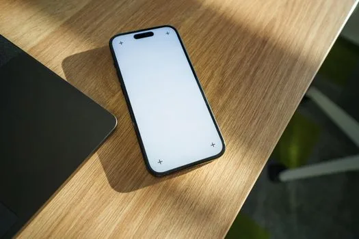 Korean user checking Instagram account privacy toggle on smartphone, clean desk realistic photo | 인스타 계정 공개범위를 확인하는 스마트폰 설정 장면