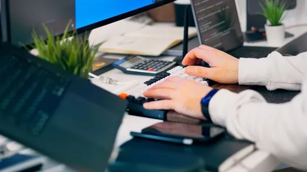 person checking official software publisher page and Windows Security protection history on laptop, clean Korean home office desk, practical cybersecurity troubleshooting scene | 공식 배포처와 보호 기록을 나란히 확인하는 장면