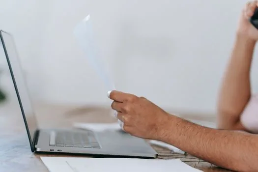 smartphone and laptop showing HWP and HWPX document viewer choices, realistic document workflow photo
