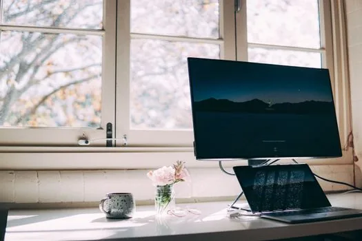 Windows 11 laptop accessibility color filters settings open beside grayscale monitor, Korean home office desk, realistic editorial photo, no logos