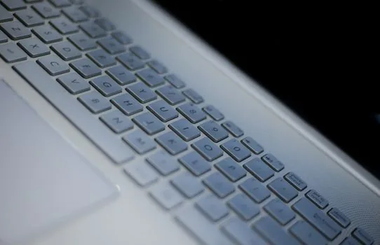 Windows 11 laptop keyboard with Windows key and plus key highlighted, enlarged document on screen, realistic Korean desk photo | 윈도우 11 돋보기 단축키로 화면을 확대하는 장면