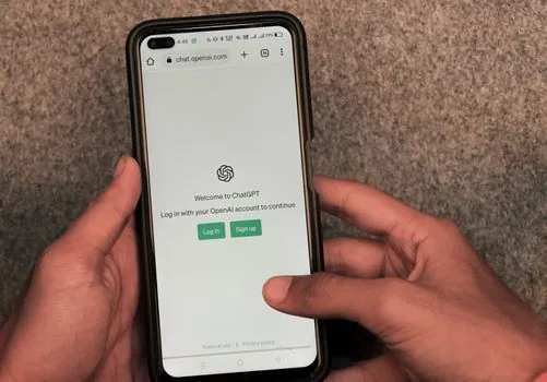 Korean user reviewing AI chatbot privacy settings on laptop and smartphone, realistic office desk, no logo, no readable text, editorial photography
